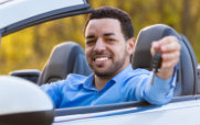 Man in Convertible Car with Keys