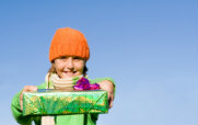 Girl Holding Holiday Wrapped Gifts
