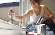 Woman Painting the Interior of a House