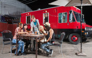 Young People Playing Eating by a Food Truck